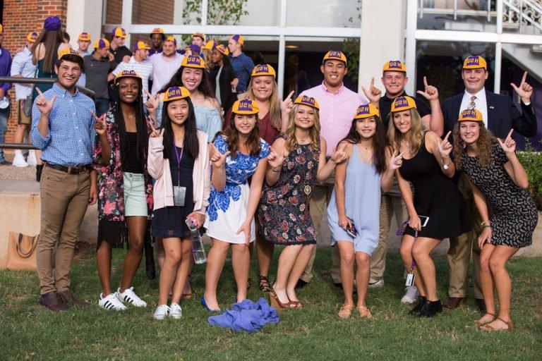 A group of new students poses after receiving their beanies in 2017.